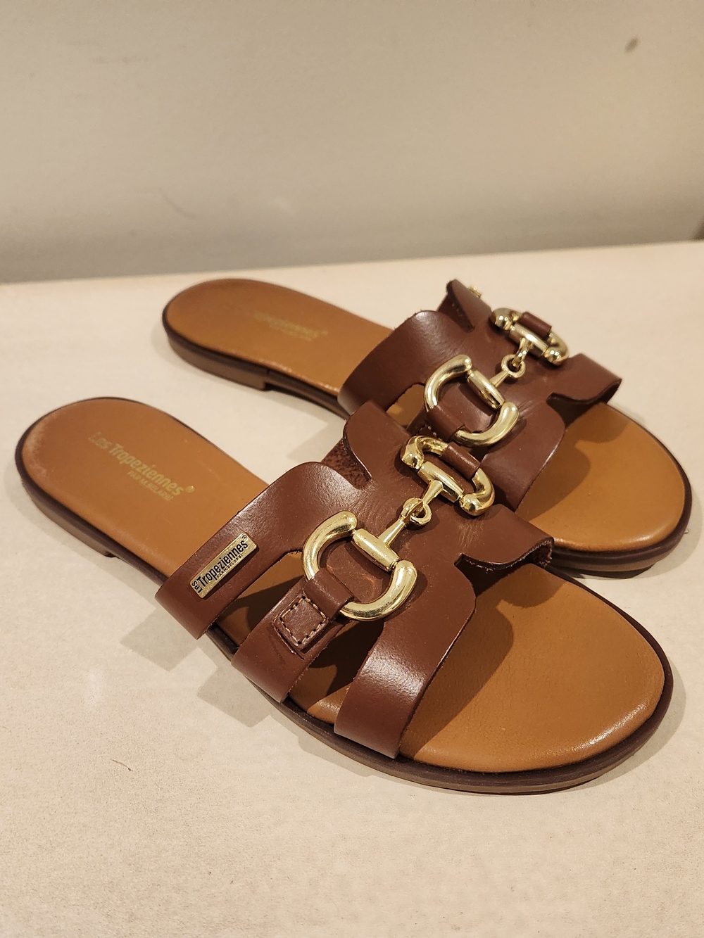 Les Tropeziennes Brown Leather Slide Sandals with Gold Buckle Detail